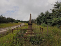 The lonely memorial stands next to the old Charlestown road (photo: 2025)